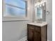 Bathroom with white marble countertop, vanity, and bright lighting at 415 S 9Th St, Leesburg, FL 34748