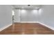 Bedroom featuring hardwood floors and neutral walls at 415 S 9Th St, Leesburg, FL 34748
