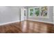 Bedroom with wood floors, bright windows, and neutral paint at 415 S 9Th St, Leesburg, FL 34748