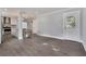 Spacious open layout includes a kitchen, dining, and living area with wood-look tile flooring at 415 S 9Th St, Leesburg, FL 34748