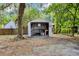 View of a shed with an open garage door for working on projects or storing tools at 415 S 9Th St, Leesburg, FL 34748