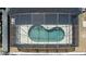 Aerial view of backyard pool with an enclosure, offering a private and relaxing outdoor space at 4411 Great Harbor Ln, Kissimmee, FL 34746