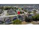 Aerial view of home in a neighborhood with a pool, landscaping, mature trees and water views at 4411 Great Harbor Ln, Kissimmee, FL 34746