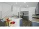 Bright modern kitchen with stainless steel appliances, tiled backsplash, and a spacious breakfast bar at 4411 Great Harbor Ln, Kissimmee, FL 34746