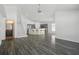 The open-concept living room features light-filled spaces and hardwood floors at 4411 Great Harbor Ln, Kissimmee, FL 34746
