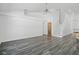 Spacious living room featuring sleek flooring and a ceiling fan at 4411 Great Harbor Ln, Kissimmee, FL 34746
