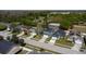 A wide shot of a neatly organized residential street with well-maintained lawns and modern homes at 4411 Great Harbor Ln, Kissimmee, FL 34746