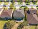 Aerial view of a home's roof, backyard patio, and surrounding neighborhood at 4842 Rockvale Dr, Kissimmee, FL 34758
