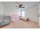Bright bedroom with two twin beds, a play tent, and natural light from the window at 4842 Rockvale Dr, Kissimmee, FL 34758