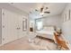 Bright bedroom with carpet, neutral paint, a ceiling fan, and an ensuite bathroom at 4842 Rockvale Dr, Kissimmee, FL 34758