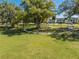 Shaded community park featuring picnic tables and benches beneath mature trees, creating a relaxing outdoor space for residents at 4842 Rockvale Dr, Kissimmee, FL 34758