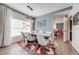 Bright dining room featuring a stylish light fixture, seating for six, and modern decor at 4842 Rockvale Dr, Kissimmee, FL 34758