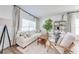 Comfortable living room with a cozy sofa, stylish armchairs, and a decorative bookshelf at 4842 Rockvale Dr, Kissimmee, FL 34758