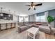 Spacious living room with a comfortable sectional sofa and an open floor plan to the kitchen at 4842 Rockvale Dr, Kissimmee, FL 34758