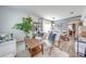 Bright living area with stylish seating, wood floors, and views into the adjacent dining room, perfect for entertaining at 4842 Rockvale Dr, Kissimmee, FL 34758