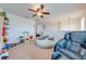 Spacious loft featuring carpeted floors, a ceiling fan, and an oversized beanbag chair at 4842 Rockvale Dr, Kissimmee, FL 34758