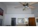 View into Primary bedroom featuring vaulted ceilings, a ceiling fan, and doorway to Primary bath at 5004 Laguna Bay Cir # 54, Kissimmee, FL 34746