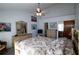 Serene bedroom featuring a ceiling fan and light-colored furniture and bedding at 5004 Laguna Bay Cir # 54, Kissimmee, FL 34746