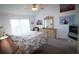 Cozy bedroom with vaulted ceiling, a ceiling fan, and light-colored furniture and decor at 5004 Laguna Bay Cir # 54, Kissimmee, FL 34746