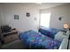 Twin bedroom featuring carpet, bright natural light and fish-themed comforters at 5004 Laguna Bay Cir # 54, Kissimmee, FL 34746
