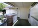 Charming covered front porch with painted wood and brick columns at 5004 Laguna Bay Cir # 54, Kissimmee, FL 34746