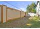 Spacious backyard featuring a tall fence and mature trees, providing privacy and shade at 5201 Lake Hinden Cv, St Cloud, FL 34771