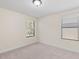 Bright bedroom with two windows providing natural light and a neutral color palette at 5201 Lake Hinden Cv, St Cloud, FL 34771