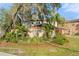 Welcoming entrance to Lake Hinden Cove with lush landscaping and a stately community sign at 5201 Lake Hinden Cv, St Cloud, FL 34771