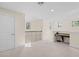 Upstairs loft area featuring cozy carpet, natural light, and flexible space at 5201 Lake Hinden Cv, St Cloud, FL 34771