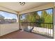 Relaxing screened patio featuring wood-style flooring and serene views of lush greenery at 5201 Lake Hinden Cv, St Cloud, FL 34771