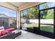 Outdoor patio with nice furniture overlooking the fenced backyard and tool shed at 5201 Lake Hinden Cv, St Cloud, FL 34771