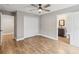 Bedroom with tile floors, ceiling fan and ensuite bathroom with a vanity and a toilet at 6592 Taxiway Cir, Orlando, FL 32822