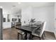 Cozy dining area with table, chairs, and bench seating, seamlessly connected to the kitchen and living spaces at 669 Persian Dr, Haines City, FL 33844