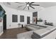 Modern living room with sleek gray sofa, accent decor, and wood flooring, creating a comfortable space at 669 Persian Dr, Haines City, FL 33844