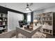 Bright home office boasts a white desk, chair, and built-in shelving for ample storage and organization at 669 Persian Dr, Haines City, FL 33844