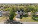 Aerial view of a two-story home with a two-car garage and mature landscaping at 673 Leland Dr, Deltona, FL 32725