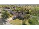 Aerial view of a two-story house with a two-car garage and well-maintained lawn at 673 Leland Dr, Deltona, FL 32725