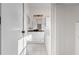 Bathroom with white vanity, granite countertop, vessel sink, tub, and tile flooring at 673 Leland Dr, Deltona, FL 32725