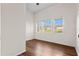 Bedroom with three windows and hardwood floors at 673 Leland Dr, Deltona, FL 32725