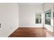 Bright bedroom with hardwood floors and a window at 673 Leland Dr, Deltona, FL 32725