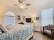 Serene bedroom with blue and white bedding, soft lighting, and a coastal-inspired decor at 759 Villa Park Rd, Poinciana, FL 34759