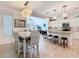 Open floorplan features a dining area with modern lighting, kitchen with island, and living room at 759 Villa Park Rd, Poinciana, FL 34759
