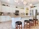 This open concept kitchen features a large island with bar seating and stainless steel appliances at 759 Villa Park Rd, Poinciana, FL 34759