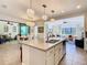 Open concept kitchen with island and ample countertop space leading to living areas at 759 Villa Park Rd, Poinciana, FL 34759