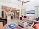 Open-concept living room showcases natural light, modern furnishings and access to kitchen and dining areas at 759 Villa Park Rd, Poinciana, FL 34759