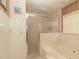 This bathroom has a shower and tub combination at 7794 Indian Ridge S Trl, Kissimmee, FL 34747