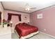 Cozy bedroom with carpet, floral décor and a ceiling fan at 7794 Indian Ridge S Trl, Kissimmee, FL 34747