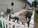 Equipment is housed behind a white picket fence next to the house at 7794 Indian Ridge S Trl, Kissimmee, FL 34747