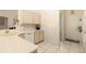 Functional kitchen with white appliances and ample countertop space, designed for meal preparation at 7794 Indian Ridge S Trl, Kissimmee, FL 34747