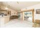 Open living area with tile flooring, sliding doors to the pool, and comfortable seating at 7794 Indian Ridge S Trl, Kissimmee, FL 34747